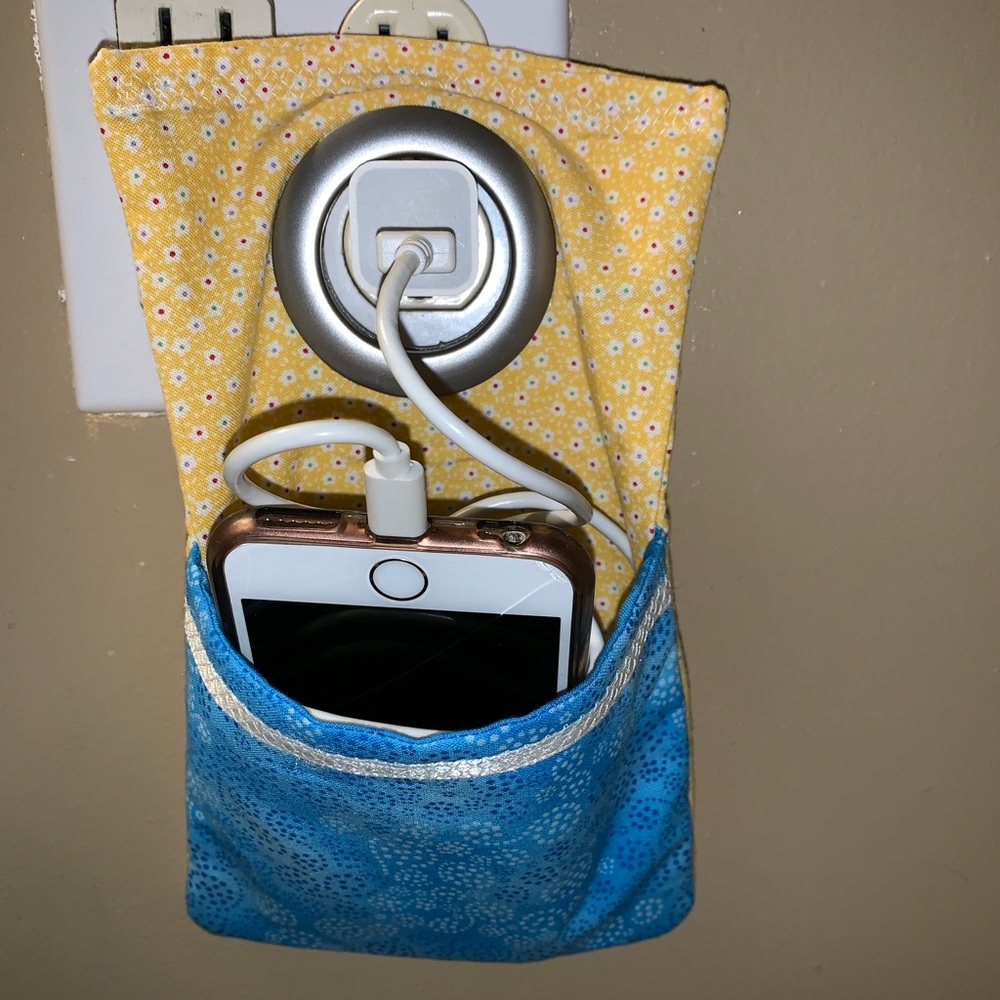 blue and yellow phone/charger holder